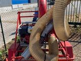 a machine that has a hose attached to the back of it