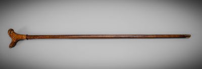 an old wooden stick with a wooden handle on a white background