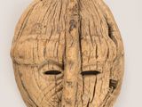 an image of a walnut nut with a face carved into it