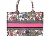 a white and pink floral bag with a pink stripe