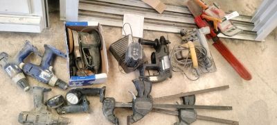a lot of tools that are laying out on the floor