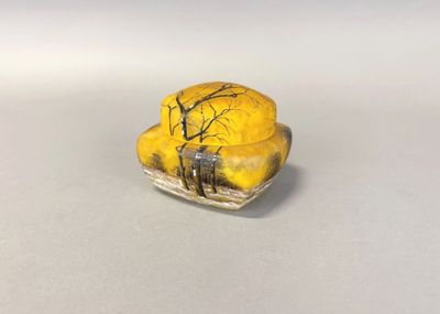 a picture of a yellow and black figurine of a man and a dog