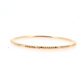 a close up of a gold ring with a small inscription on it