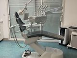 a dentist ' s chair in the middle of a room