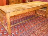 a wooden table with a drawer on top of it