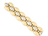 a close up of a gold bracelet on a white background