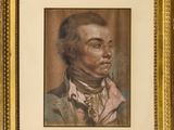 portrait d'un homme en costume-cravate dans un cadre doré