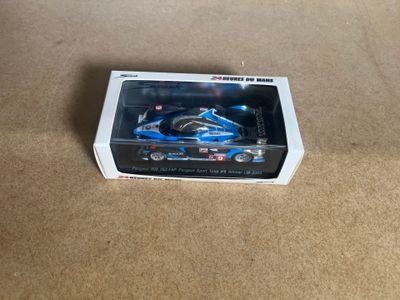 a toy car in the box on the floor