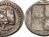 une pièce d'argent sur laquelle est représenté un lion
