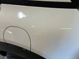 a close up of a white car with black trims