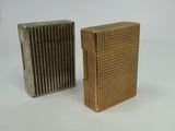 two lighters sitting side by side on a white surface