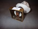 a small box that has a picture of a man in a hat inside of it