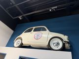 a picture of a car on display in a museum