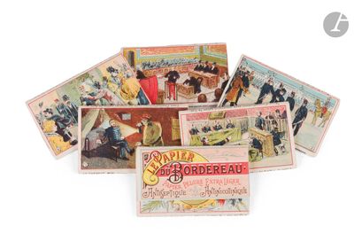 a lot of old postcards sitting on a white surface