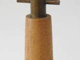 a wooden bottle with a metal top on a white surface