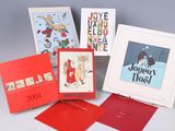 several christmas cards are arranged in a row on a table