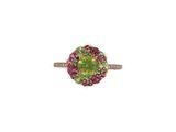 a close up of a ring with a green and pink stone