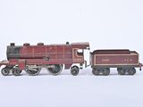 a toy train that is sitting on a white surface