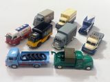 a lot of toy trucks that are sitting on a table