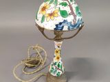 a lamp that is sitting on a table with a cord