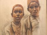 painting of two black children in a brown frame with a white background
