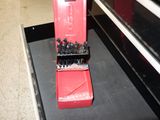 a red box that has a bunch of screws in it