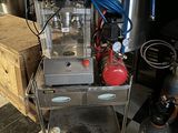 a machine that is sitting on a cart in a room