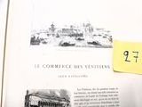 un livre ouvert sur lequel figure l'image d'une ville