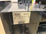 a label on the back of a machine that is sitting on a table