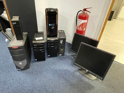 a lot of computer equipment that are sitting on the floor