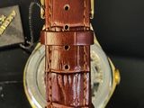 an image of a close up of a watch on a table