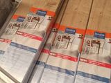 a lot of boxes of wood sitting on the floor