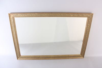 gold framed mirror on a white wall with a white background