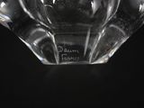 a close up of a glass vase on a black surface