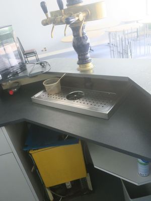 an image of a kitchen with a sink and a computer