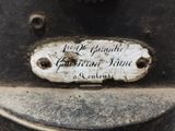 a sign on the back of an old fashioned stove