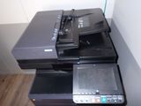 a printer and a scanner sitting on top of each other