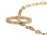 an image of a gold bracelet with a cross on it