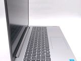 a silver laptop computer sitting on top of a white table