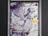 a close up of a pokemon trading card on a black surface