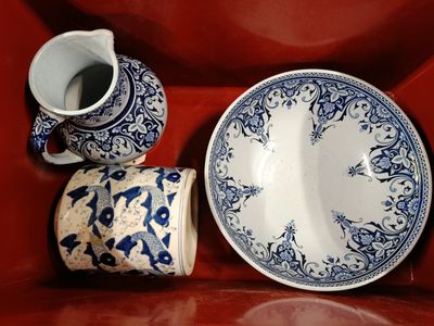 a blue and white plate and a blue and white cup and saucer