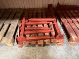 several wooden pallets are stacked on top of each other in a garage
