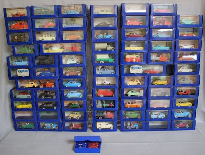 a lot of toy cars that are in a display case