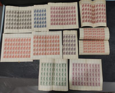 a table topped with lots of different types of stamps on top of each other