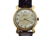 an image of a wrist watch with a brown leather strap