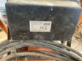 an image of a close up of a cable connected to a machine