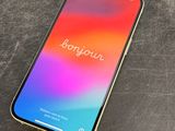 a close up of a phone on a table with a blurry background