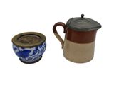 a coffee pot and a cup of coffee on a white background