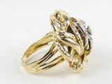 a close up of a gold ring with a diamond in the center