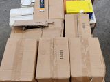 a pile of boxes on a carton on the street